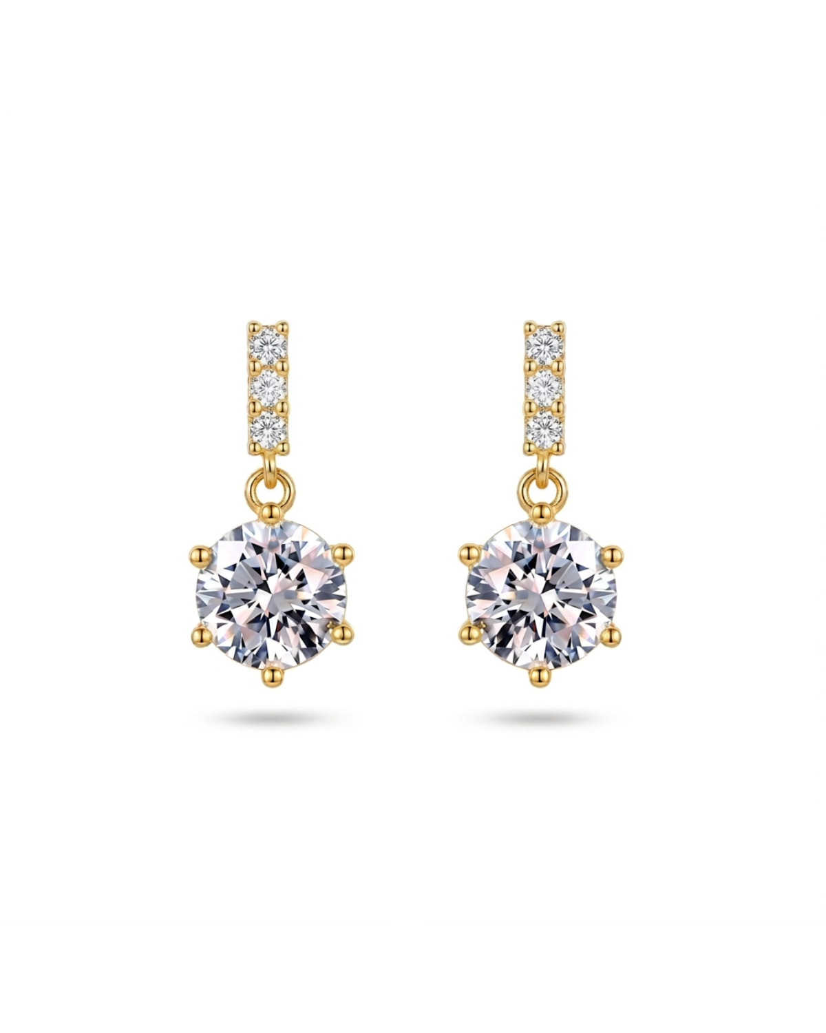 Pair of earrings with purple gemstones and diamond accents on a white background