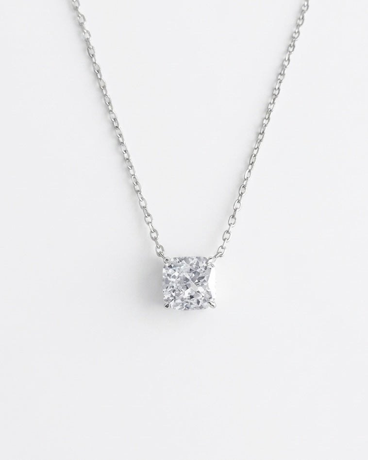 Diamond necklace on a light gray background