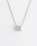 Diamond necklace on a light gray background